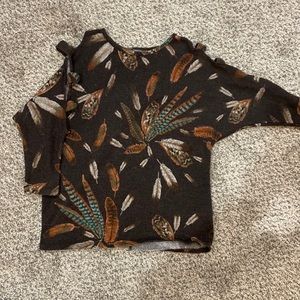 Woman’s open shoulder sweater